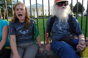 Allegra Stout protests outside the White House with a leader