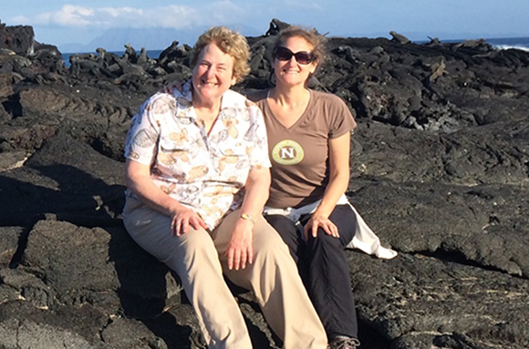 Elana and Stephanie sitting on rocks. 