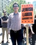 Ari Fertig holds sign that says "Jewish Labor Committee"