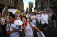 JOIN Fellow with Megaphone at the front of a Never Again Action march. 