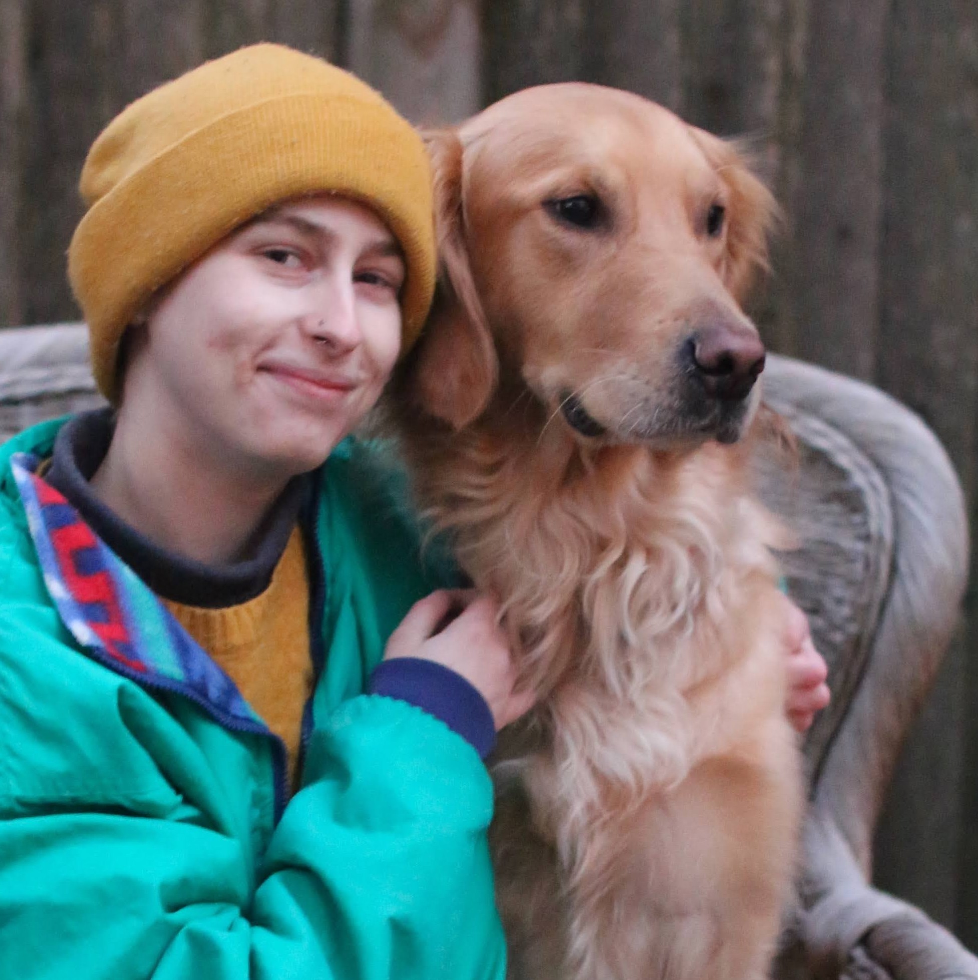 photo of Kayla Neumeyer with her dog Miles a golden retriever