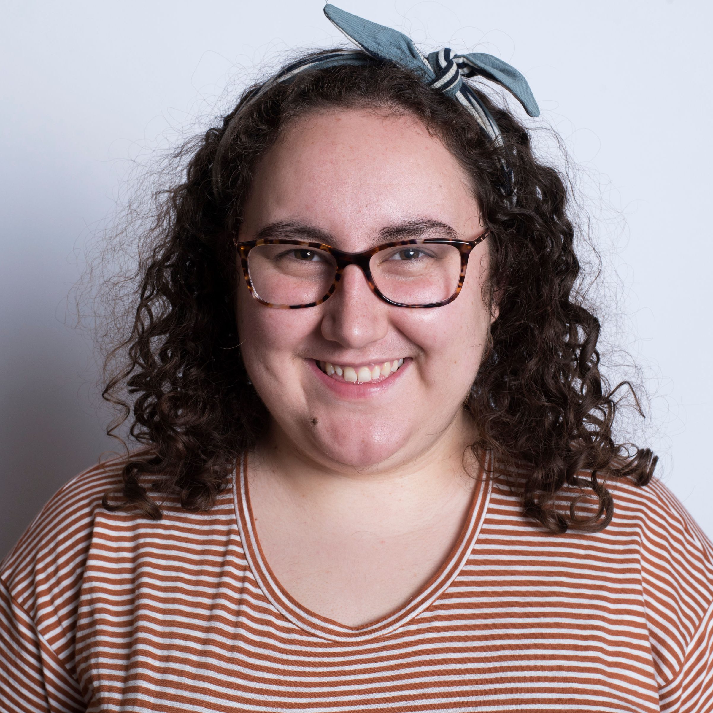 headshot of Shay McIntosh in front of a white wall