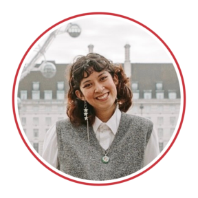 headshot of Ellie Tang Kleiman in front of a building with many windows